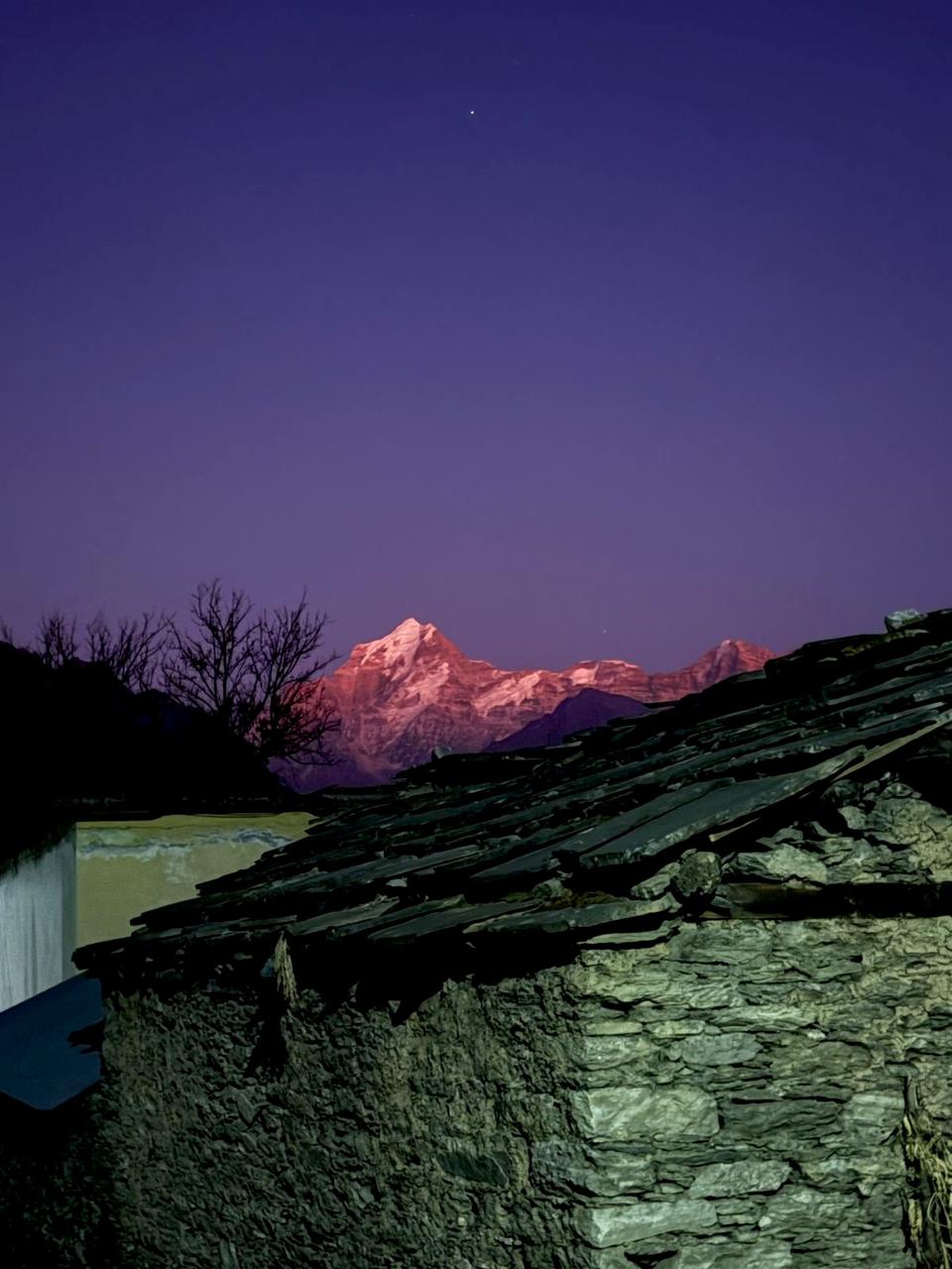 Campsite with distant Himalayan peaks